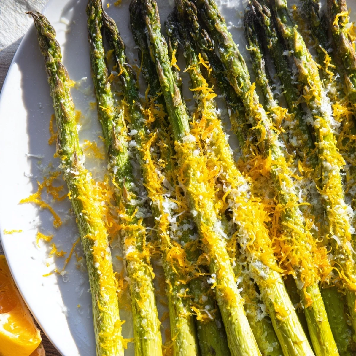 Tender, flavorful Roasted Asparagus with Lemon Zest and Parmesan ready to be served hot.