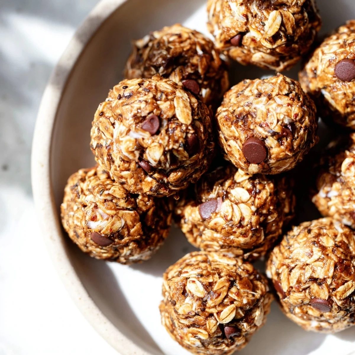 Golden-brown Almond-Chia Energy Bites ready to eat, perfect for a quick and wholesome snack.