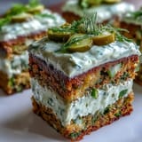 A visually stunning Pickle Cake layered with dill cream cheese frosting, perfect for parties.