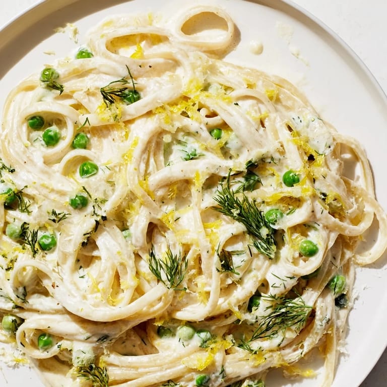 Linguine coated in luscious Creamy Dill Pasta, garnished with fresh dill and Parmesan cheese.