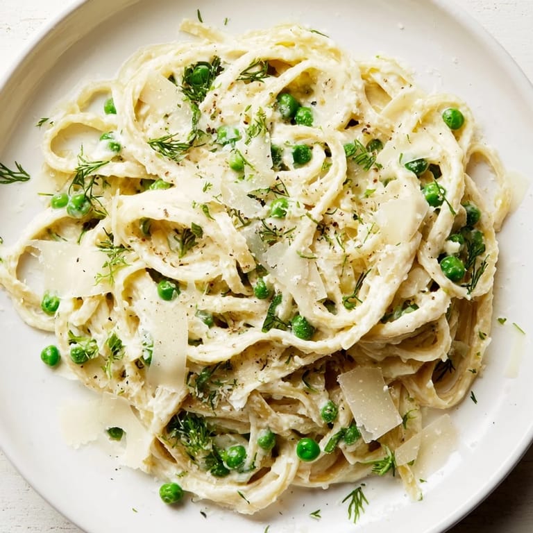 A close-up of a delightful plate of creamy, flavorful Creamy Dill Pasta, a perfect vegetarian meal.