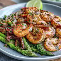 Healthy Easy One-Pan Lemon Garlic Shrimp and Asparagus: juicy shrimp and crisp asparagus tossed in a bright lemon-garlic sauce, roasted to perfection in a single pan for quick cleanup.
